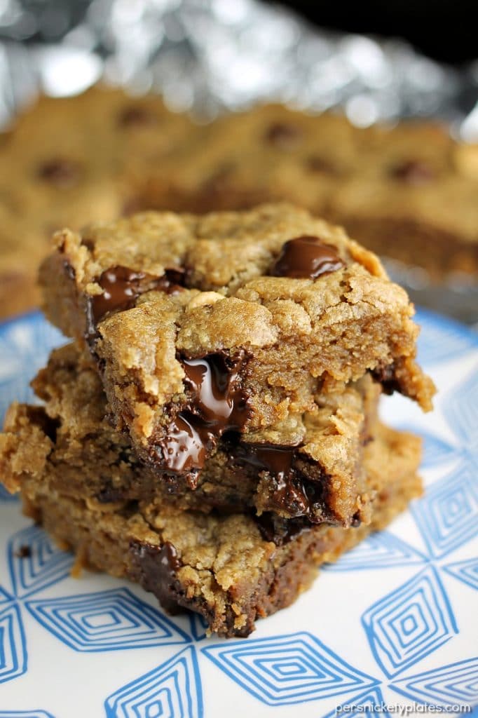 Peanut Butter Blondies filled with chocolate chips and peanut butter chips are soft and chewy and begging to be topped with vanilla ice cream! | Persnickety Plates
