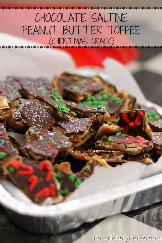 Chocolate Saltine Peanut Butter Toffee {Christmas Crack} | Persnickety Plates tray full of saltine cracker toffee topped with christmas sprinkles