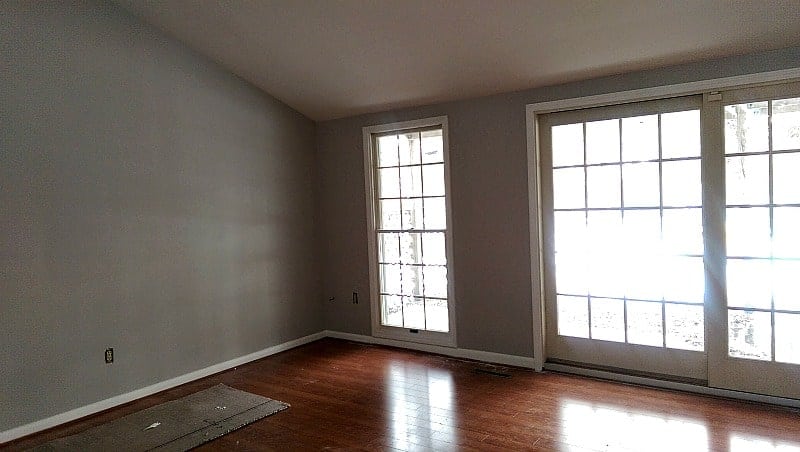 Before and after pictures of our living room/dining room done on a budget. Changing paint makes a huge difference - with Benjamin Moore Stonington Gray & Timber Wolf | Persnickety Plates