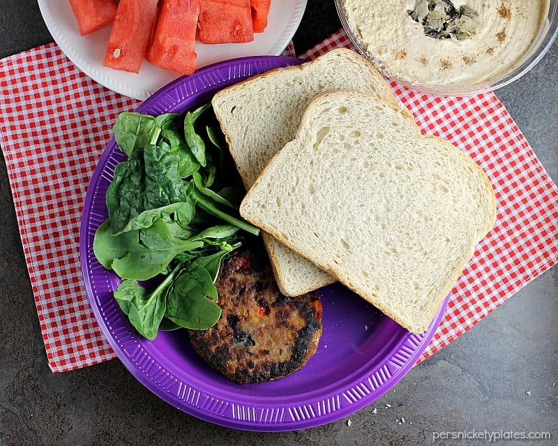 Vegetarians can enjoy barbecues, too! This Veggie Burger with Spinach and Hummus is the perfect alternative to traditional hamburgers for your next BBQ. | Persnickety Plates