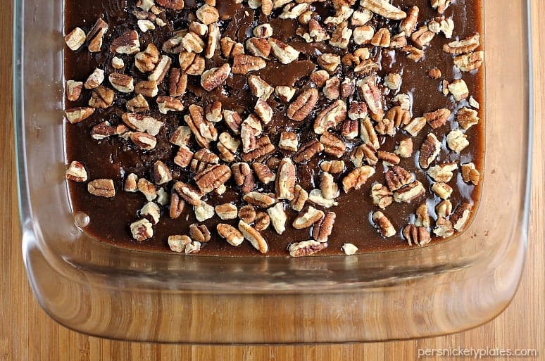 Salted Chocolate Caramel Bars start with a layer of chocolate shortbread, topped with a thick layer of homemade salted caramel, and finished off with toasted pecans. | Persnickety Plates