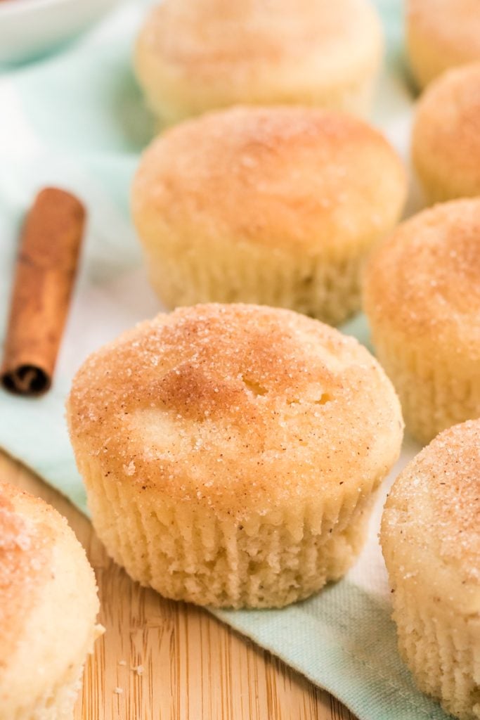 several french breakfast puffs on a teal napkin.
