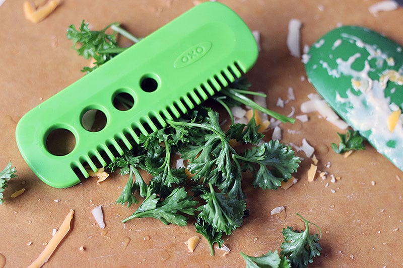 Homemade Baked Macaroni and Cheese is a delicious, super rich, five cheese baked mac and cheese recipe. This copycat steakhouse recipe is fancy enough to serve to guests for holidays, but so delicious, you'll want to make this easy baked mac and cheese recipe every day! www.persnicketyplates.com oxo herb stripping comb with parsley