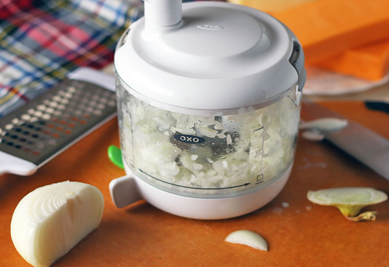 Homemade Baked Macaroni and Cheese is a delicious, super rich, five cheese baked mac and cheese recipe. This copycat steakhouse recipe is fancy enough to serve to guests for holidays, but so delicious, you'll want to make this easy baked mac and cheese recipe every day! onion chopper on cutting board