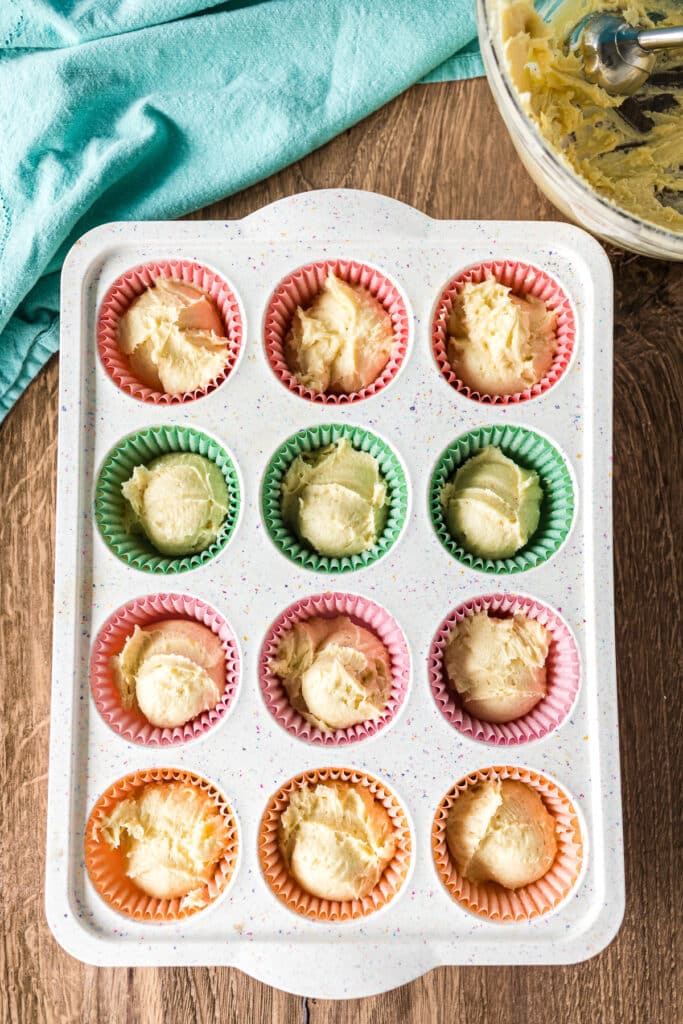 overhead shot of cupcake batter in a cupcake pan.