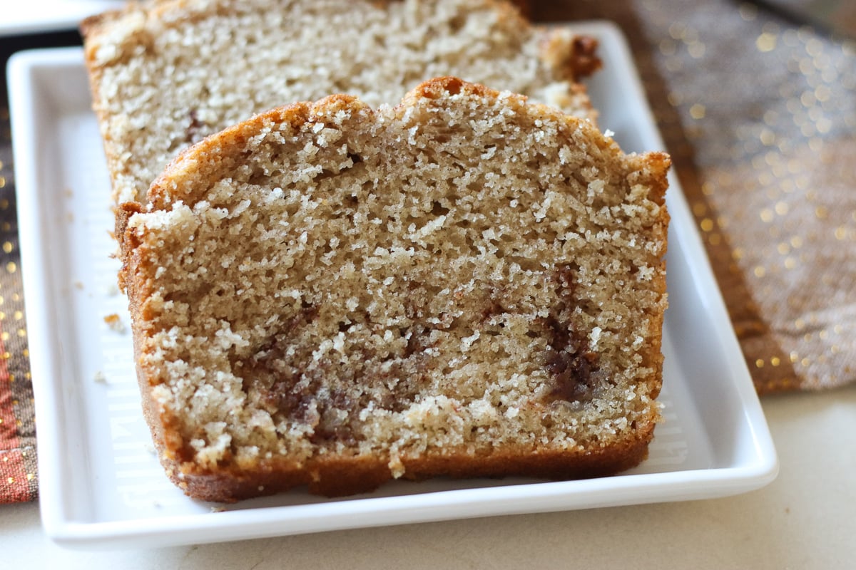 slice of cinnamon quick bread on white plate