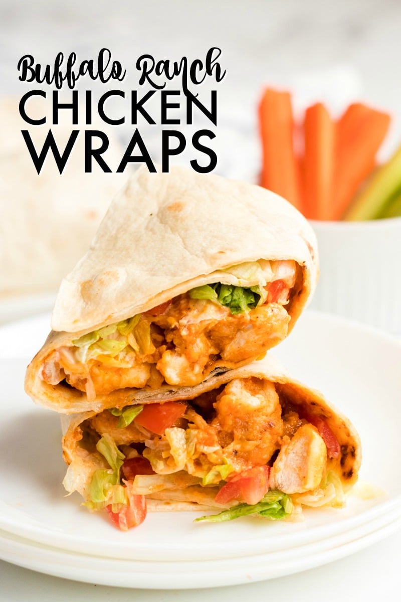 If you like the Buffalo Ranch Chicken Wrap from Buffalo Wild Wings, you'll love this lightened up homemade version! Lightly breaded buffalo chicken pieces wrapped up in a soft tortilla with ranch dressing, shredded lettuce, cheese, and tomatoes make a great dinner or the perfect game day meal! | www.persnicketyplates.com sliced & stacked buffalo ranch chicken wrap on white plate