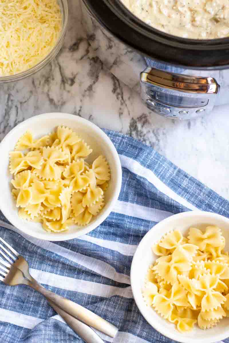 overhead shot of bowtie noodles in white bowls