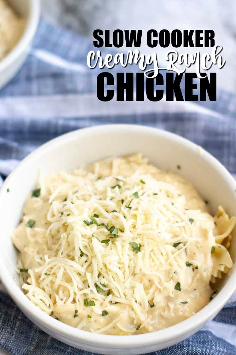 bowl of creamy ranch chicken topped with cheese & parsley