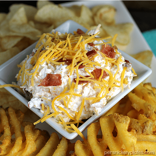 Loaded Baked Potato Dip only has three ingredients and is perfect for game day snacking. If you love loaded baked potatoes, you'll love dipping your chips or potato wedges into this simple dip! | www.persnicketyplates.com