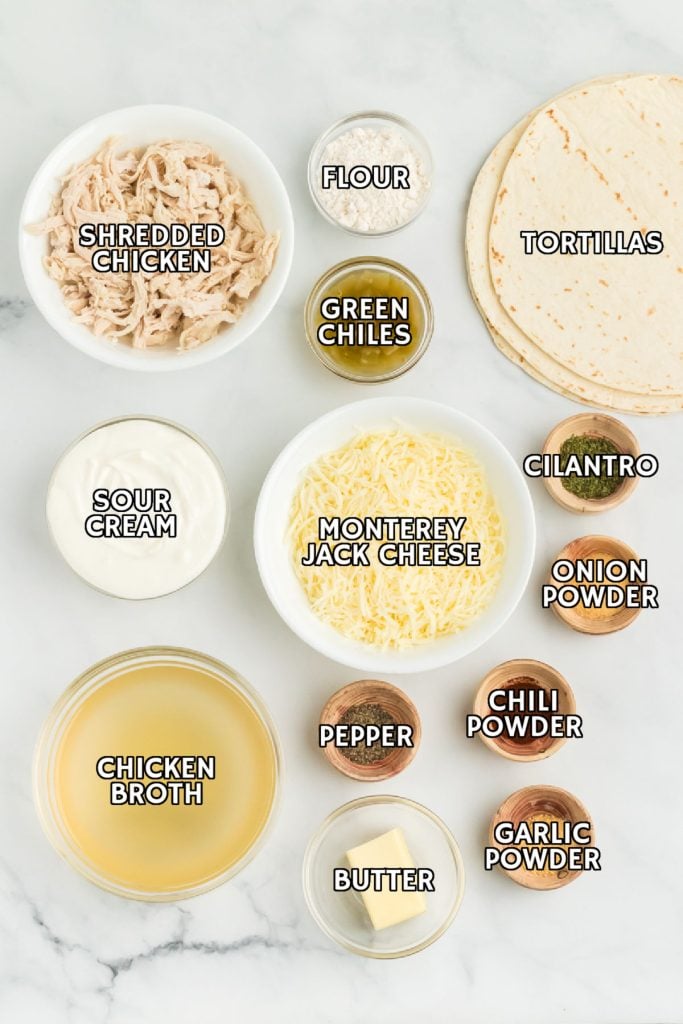 overhead shot of labeled ingredients laid out to make chicken enchiladas.