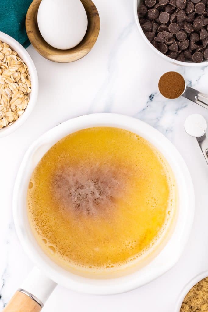 overhead shot of brown butter in a saucepan.
