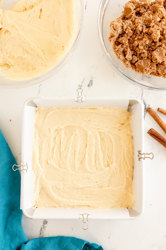 overhead shot of coffee cake batter in a square baking dish.