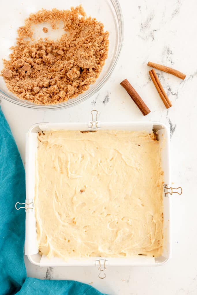 overhead shot of cake batter in a square baking dish.
