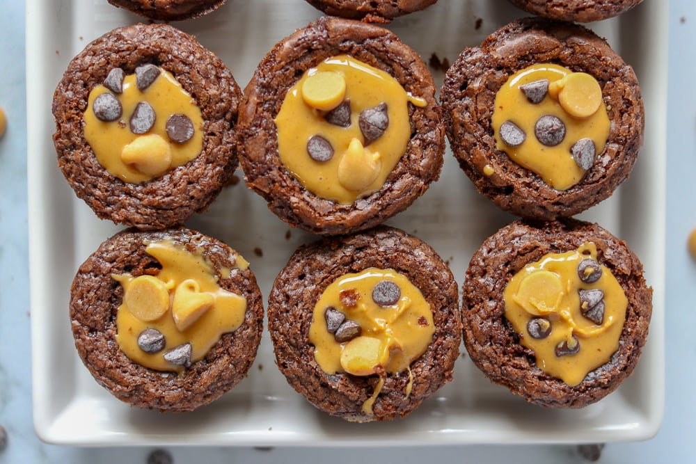 six brownie bites topped with peanut butter and chocolate chips
