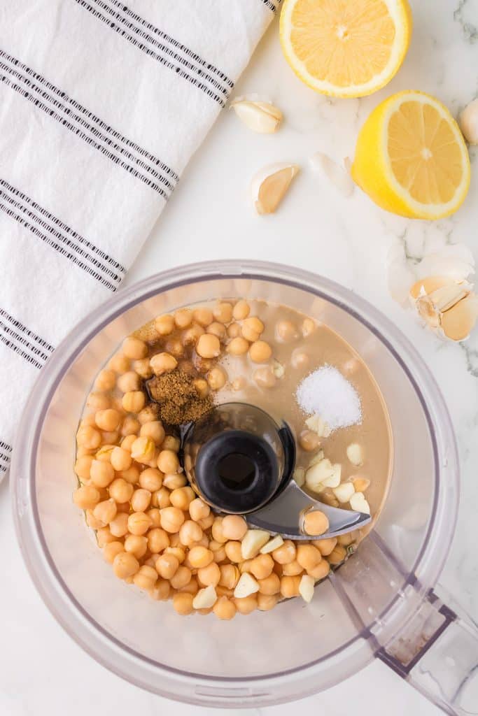 overhead shot of chickpeas in a food processor.