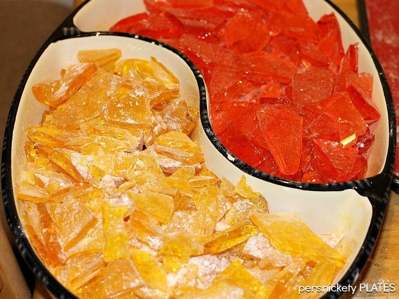 Homemade Hard Candy is easy to make and really easy to customize to whatever flavor and color you want! This hard candy recipe will become a favorite in your family. | www.persnicketyplates.com #hardcandy #candy #christmascandy #christmas overhead shot of candy dish with homemade hard candy
