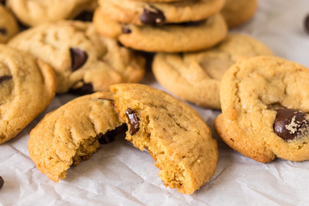 broke chocolate chip cookie with a melty chocolate chip.