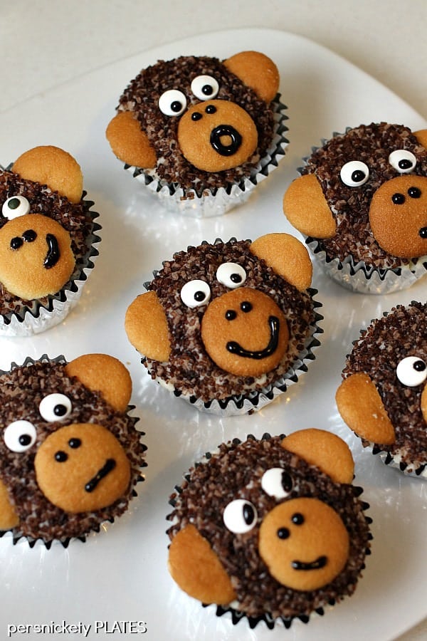 Monkey Cupcakes are such a cute dessert idea, you may not want to eat them! These delicious homemade chocolate cupcakes are made with chocolate sanding sugar and vanilla wafer ears! Perfect for a monkey themed birthday party!