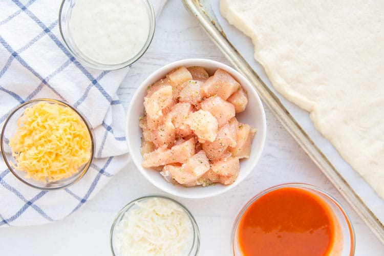 chicken, cheeses, buffalo sauce mise en place