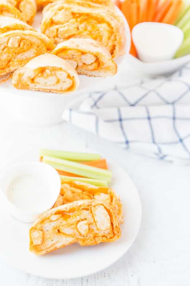 plate of buffalo chicken bread with celery & carrots & ranch for dipping.