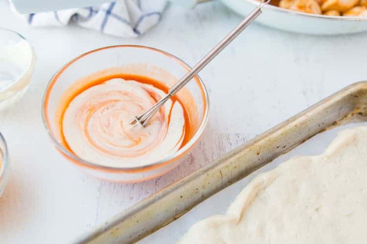 buffalo sauce mixed with ranch in small bowl