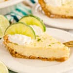 slice of key lime pie on a white plate.