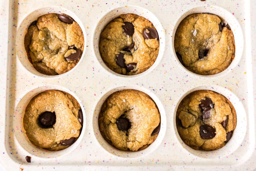 closeup of chocolate chip cookie cups in a pan.