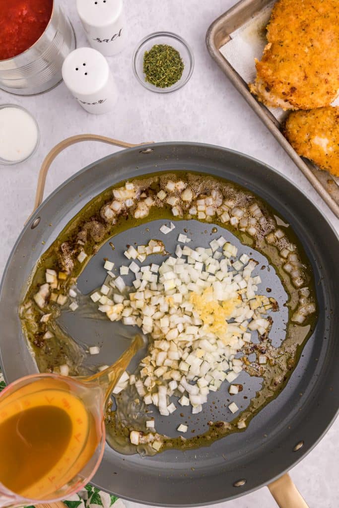 onions sauteing in a skillet.