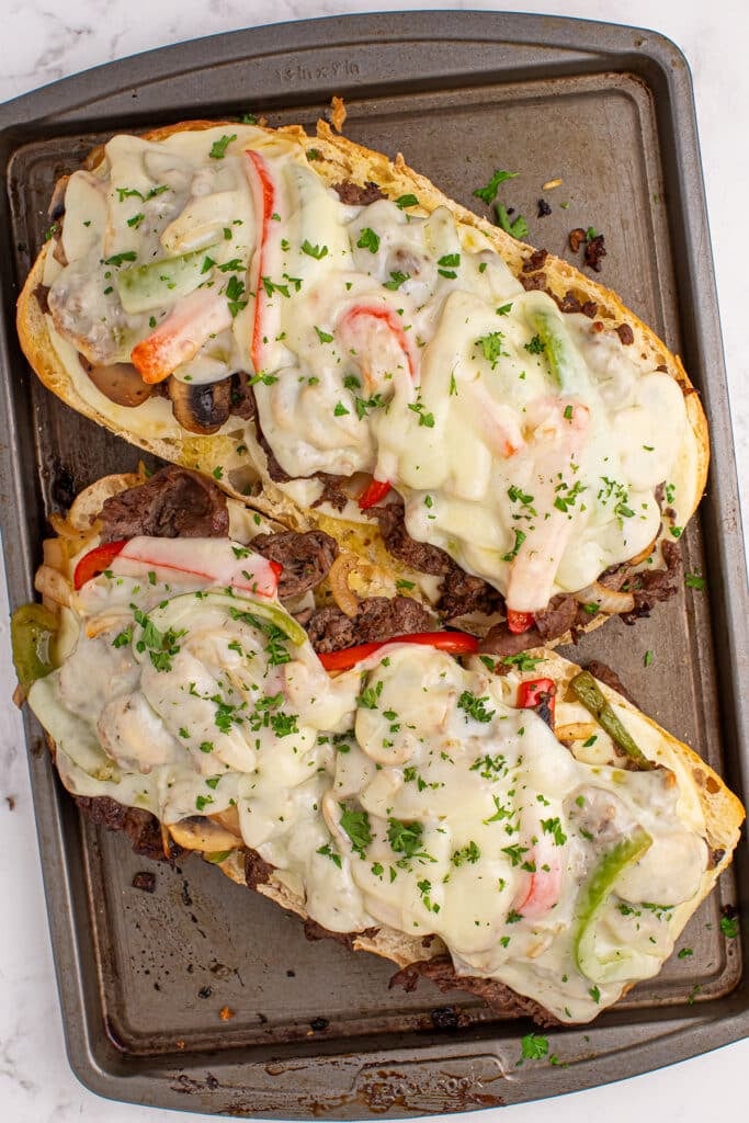 overhead shot of cheesy philly cheesesteak bread.