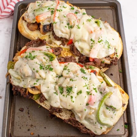 overhead shot of philly cheesesteak bread on a baking sheet.