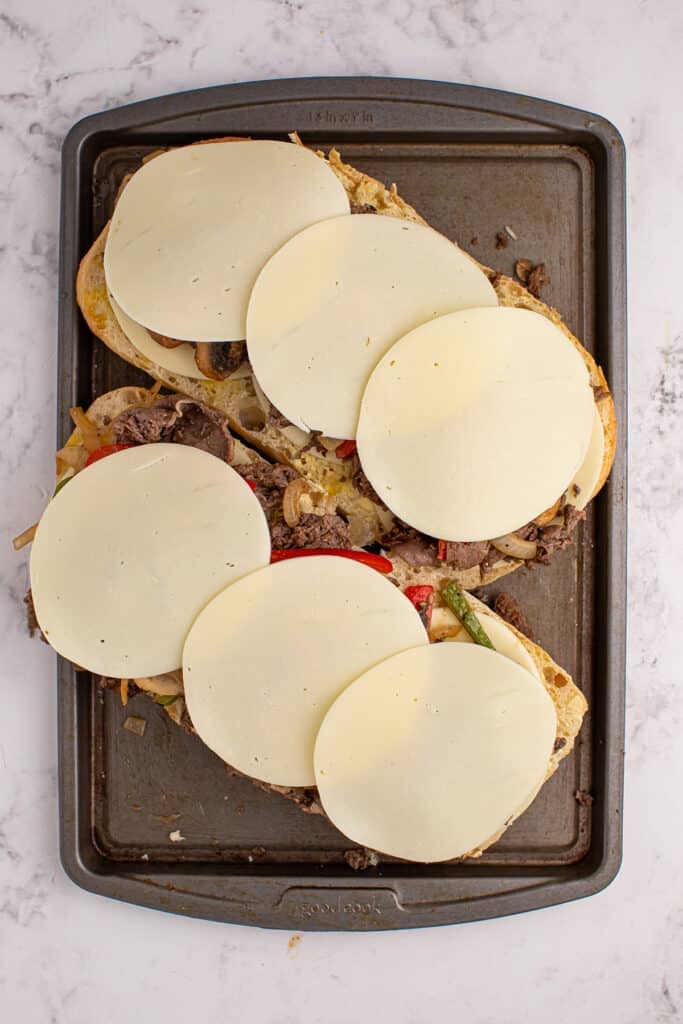 provolone rounds on top of a sandwich.