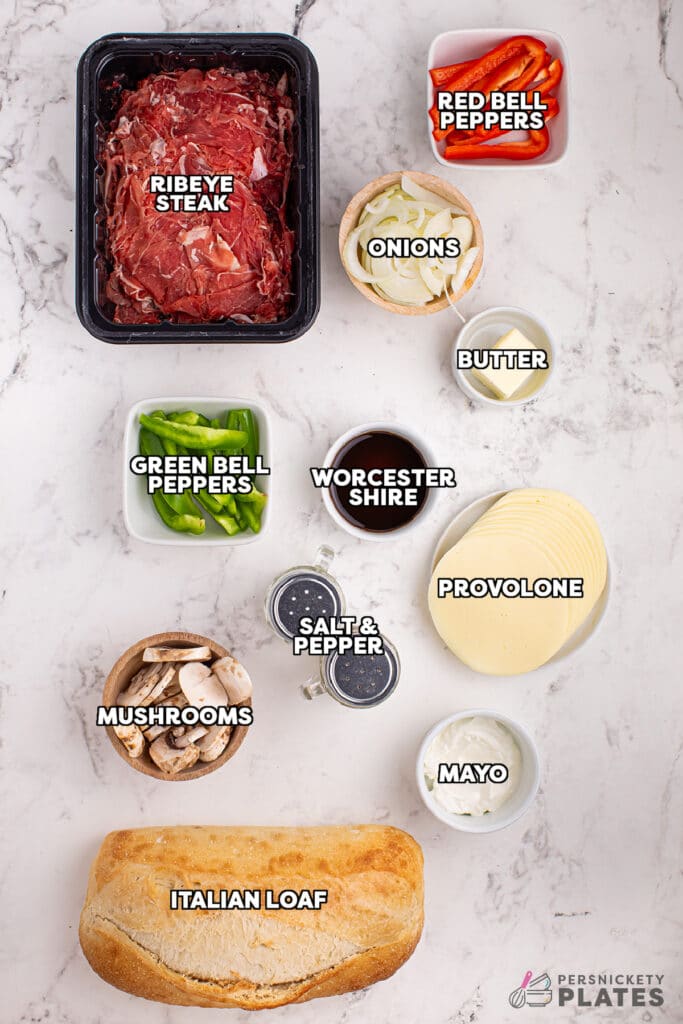 overhead shot of labeled ingredients laid out to make philly cheesesteak bread.