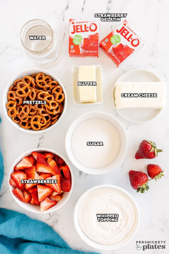 overhead shot of labeled ingredients laid out to make strawberry pretzel salad.