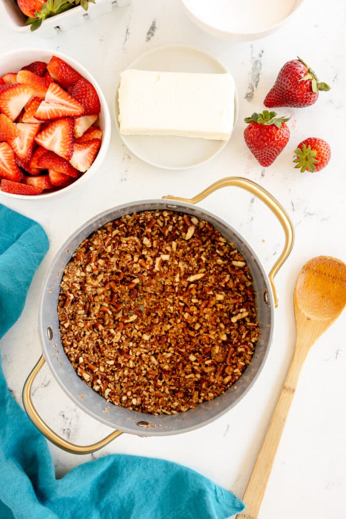 crushed pretzels with sugar and butter in a saucepan.