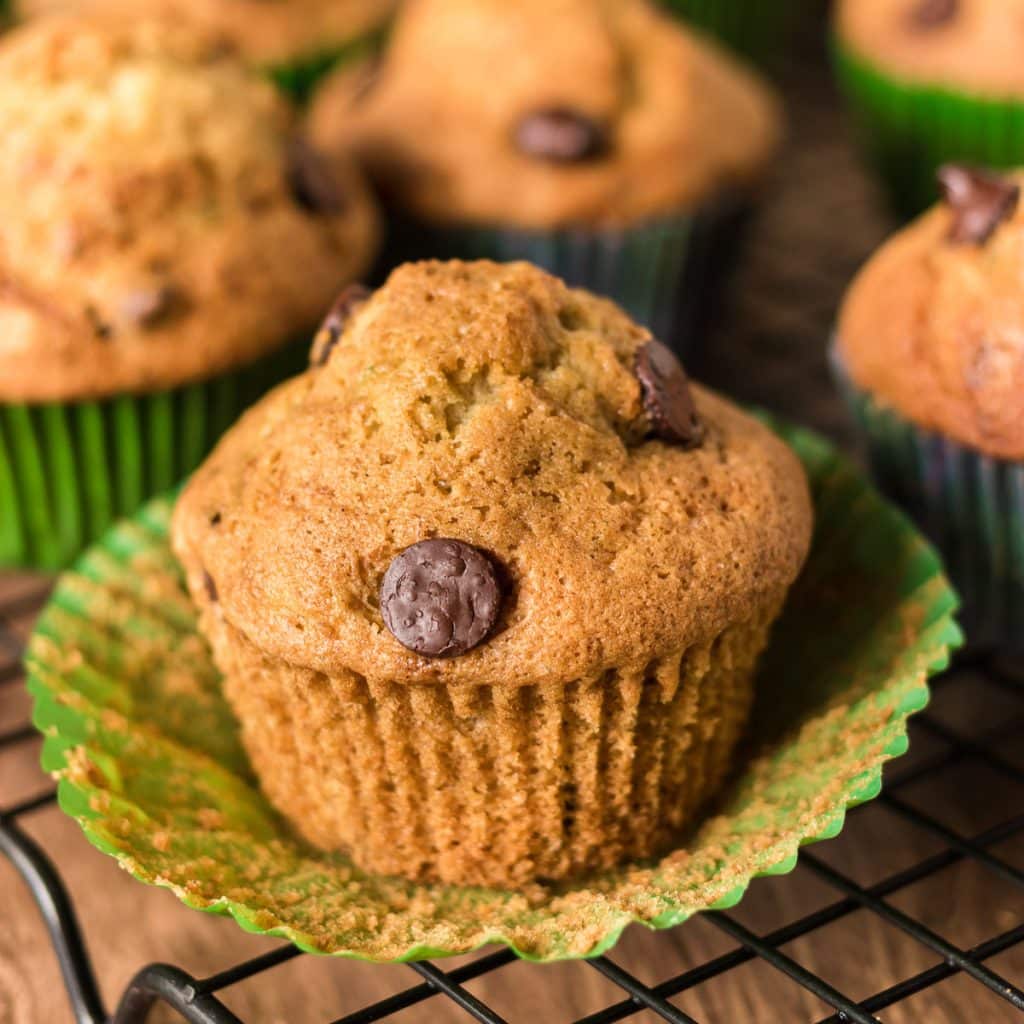 chocolate chip zucchini muffin with the wrapper peeled off.
