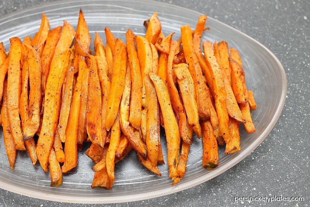 One of my favorite side dishes/snacks - oven baked sweet potato fries with a little kick of chili powder! | www.persnicketyplates.com