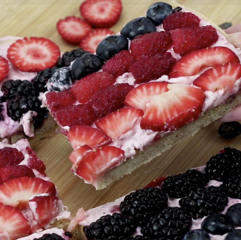 slice of fruit pizza being lifted.