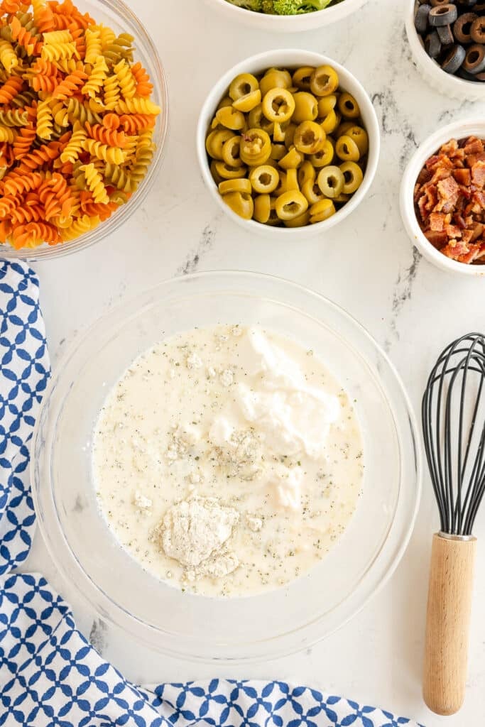 ranch seasoning, sour cream, and milk in a mixing bowl.