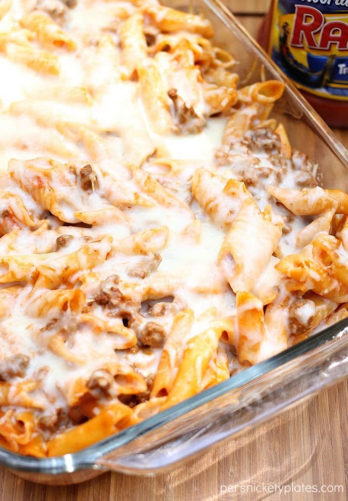 Baked Mostaccioli is a super simple and tasty pasta with a blend of marinara and alfredo sauces. With only five ingredients, it comes together fast and is perfect for an easy dinner! | www.persnicketyplates.com baked mostaccioli covered in melted cheese