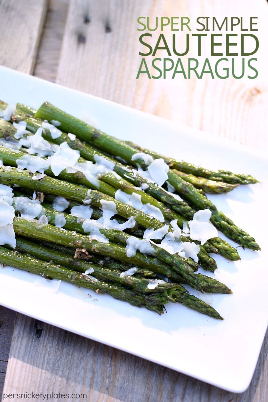 Sauteed Asparagus is a deliciously easy side dish that goes from stove to table in less than 15 minutes. Made with 6 ingredients, this is the best sauteed asparagus recipe that is packed full of flavor and perfect for any dinner plate. | www.persnicketyplates.com asparagus on a white plate sprinkled with cheese