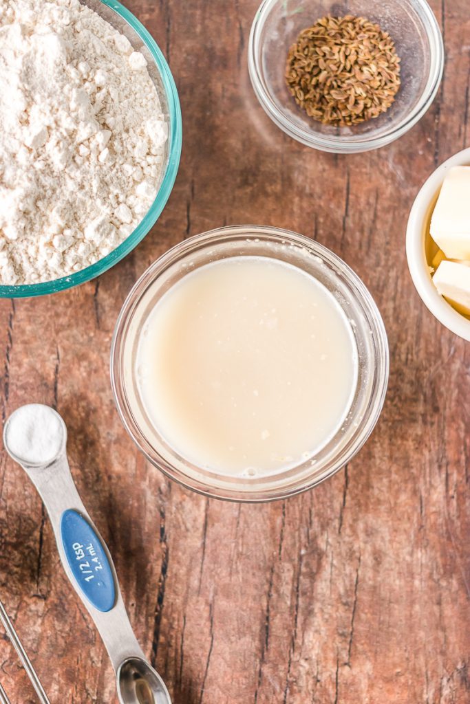yeast dissolving in a bowl of warm water