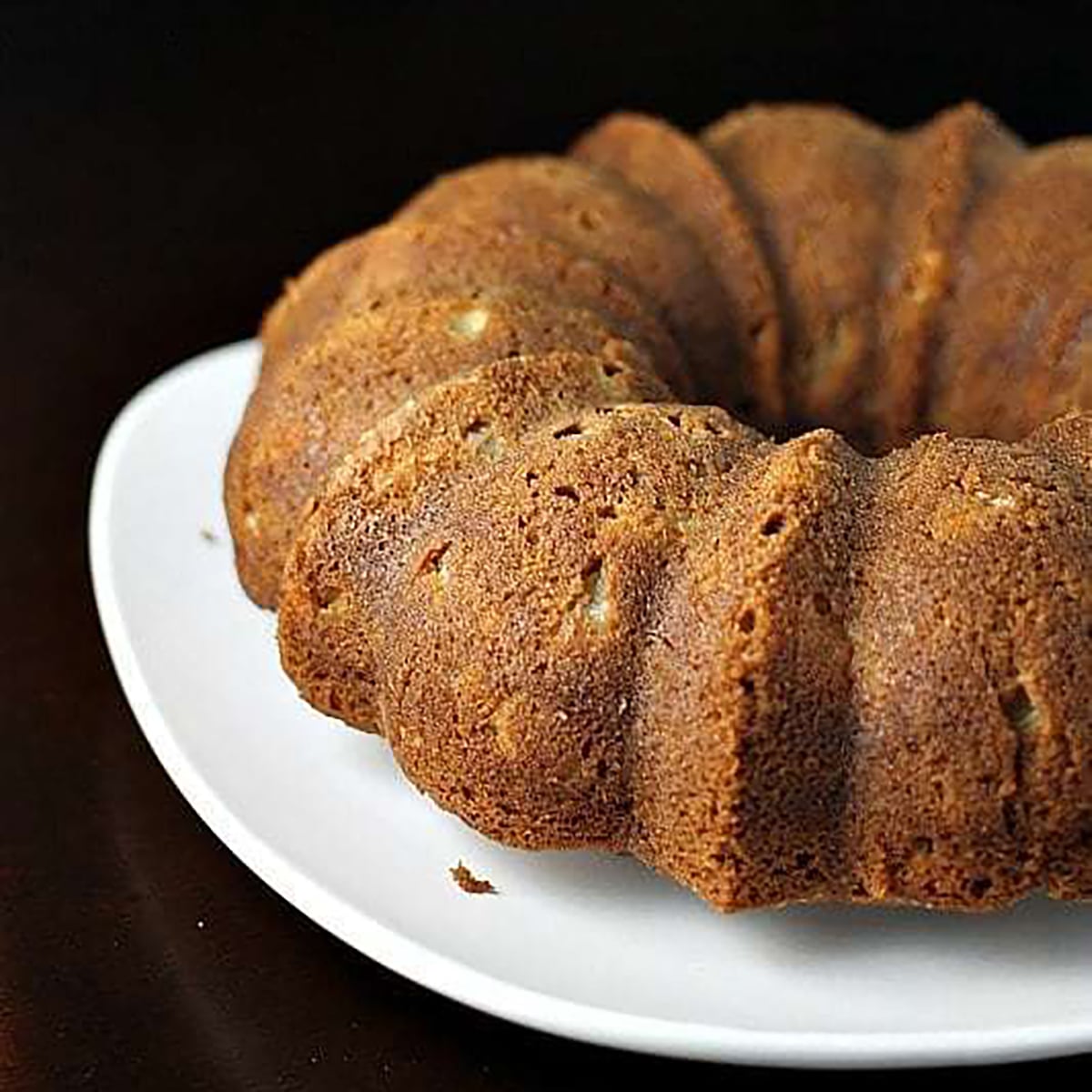 apple bundt cake on white platter