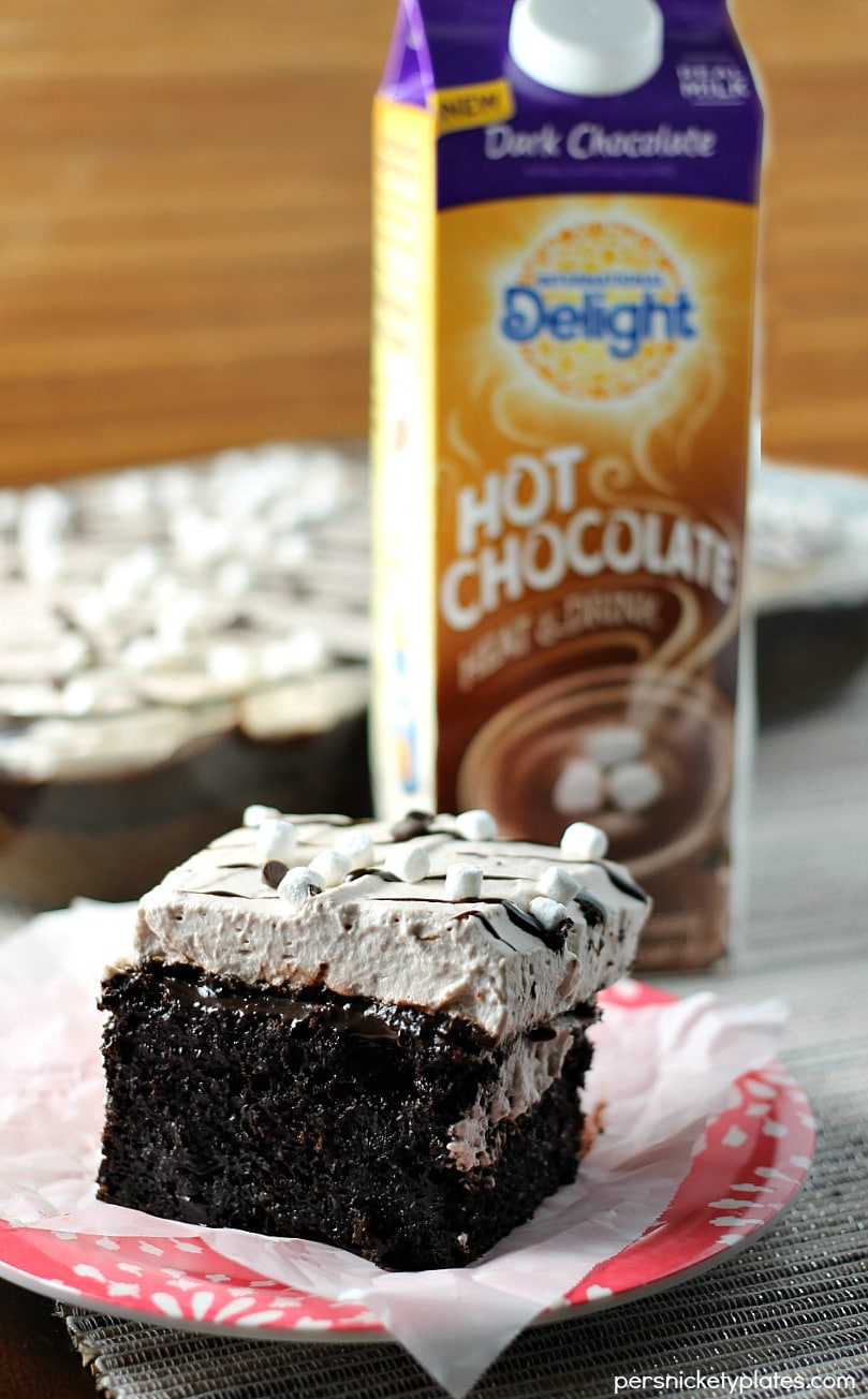 This Hot Chocolate Poke Cake takes everything you love about hot chocolate and puts it into cake form. Perfect for a holiday celebration! | Persnickety Plates