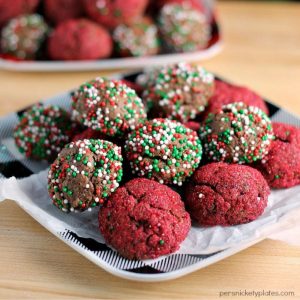 plate full of chocolate fudge cookie bites covered in christmas sprinkles