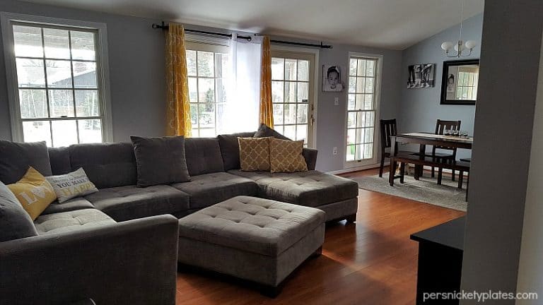 Before and after pictures of our living room/dining room done on a budget. Changing paint makes a huge difference - with Benjamin Moore Stonington Gray & Timber Wolf | Persnickety Plates
