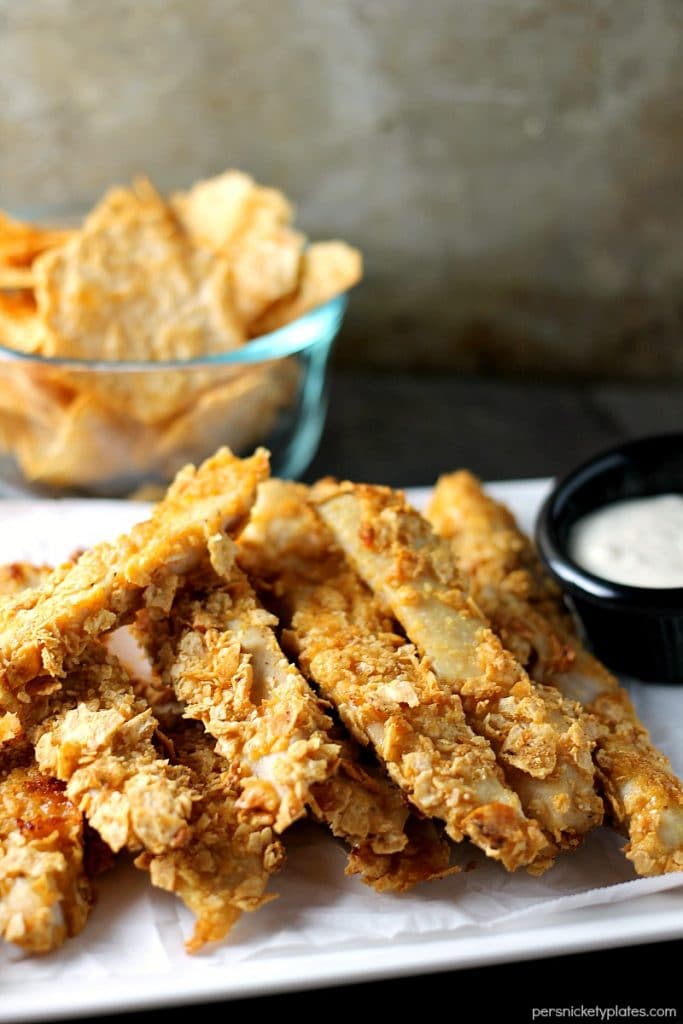Crispy Baked BBQ Chicken Strips made with Van’s Simply Delicious® Multi-Grain BBQ Chips - 30 minute weekday dinner! This gluten free chicken strips recipe is made with just 3 simple ingredients! #glutenfree #chicken #recipe | Persnickety Plates platter of Gluten free Crispy Baked BBQ Chicken Strips