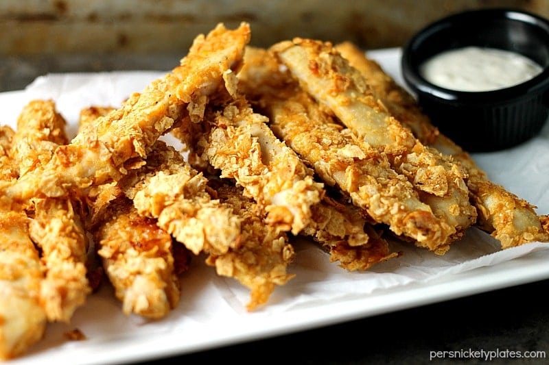 Crispy Baked BBQ Chicken Strips made with Van’s Simply Delicious® Multi-Grain BBQ Chips can be whipped up in about 30 minutes so they're perfect for a weekday dinner! This gluten free chicken strips recipe is made with just 3 simple ingredients! Gluten free Crispy Baked BBQ Chicken Strips