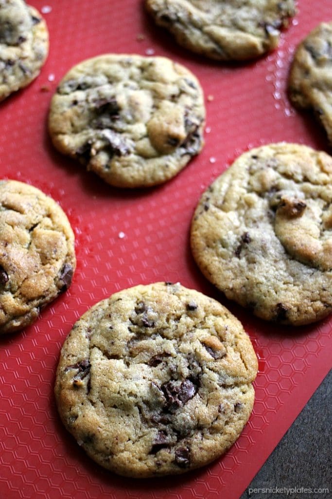 chocolate chip cookies on a red silicone mat