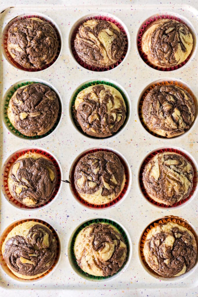 overhead shot of nutella muffins in a muffin tin.